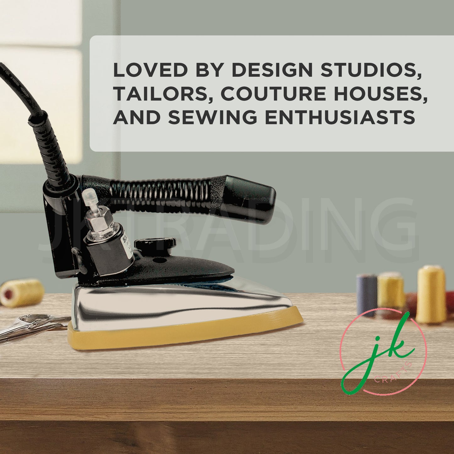 Premium JKCrafts industrial ironing system resting on a wooden studio workbench next to sewing thread spools.