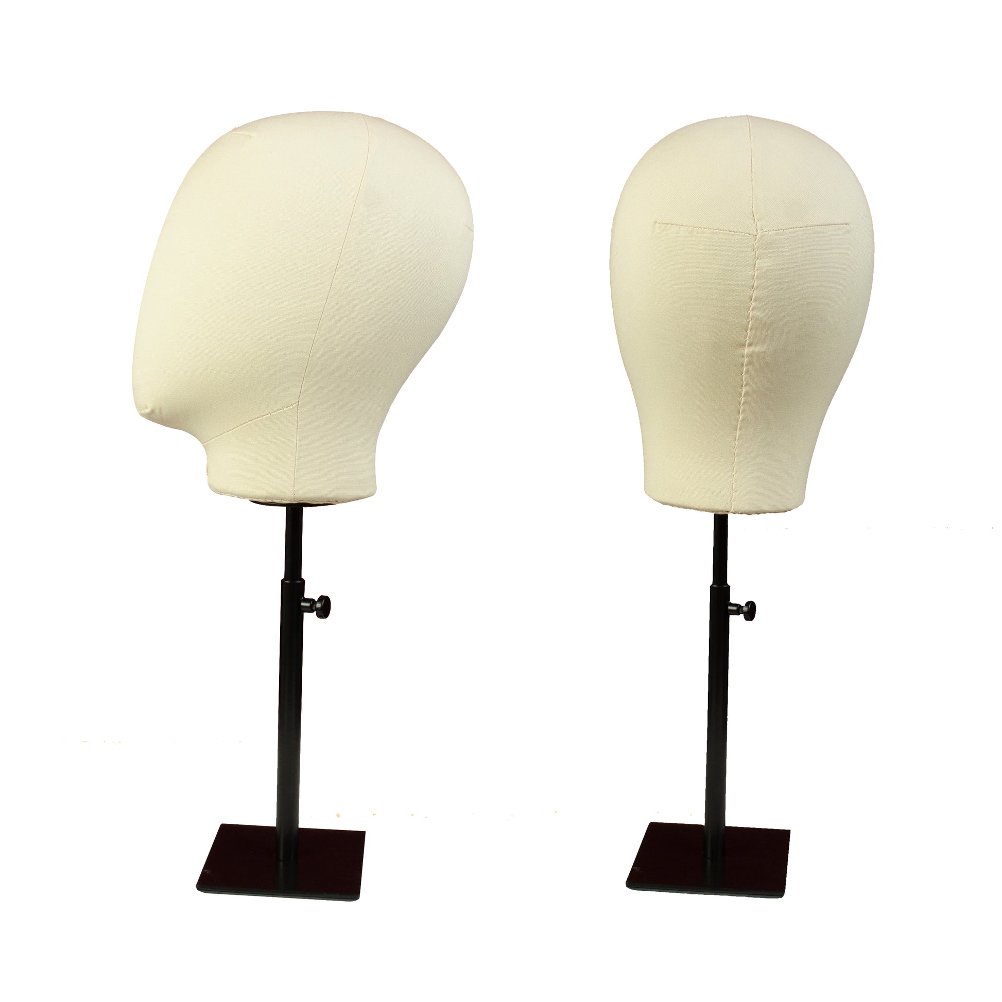 Two mannequin heads on stands with white covers on a white background