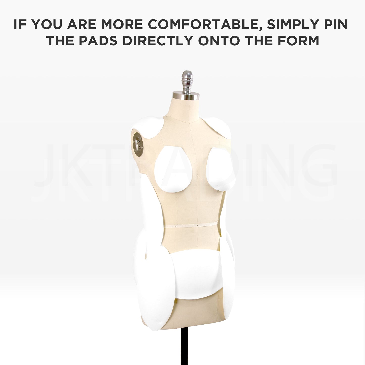 White contoured foam padding pieces pinned directly onto a linen-covered dressmaking sewing form.