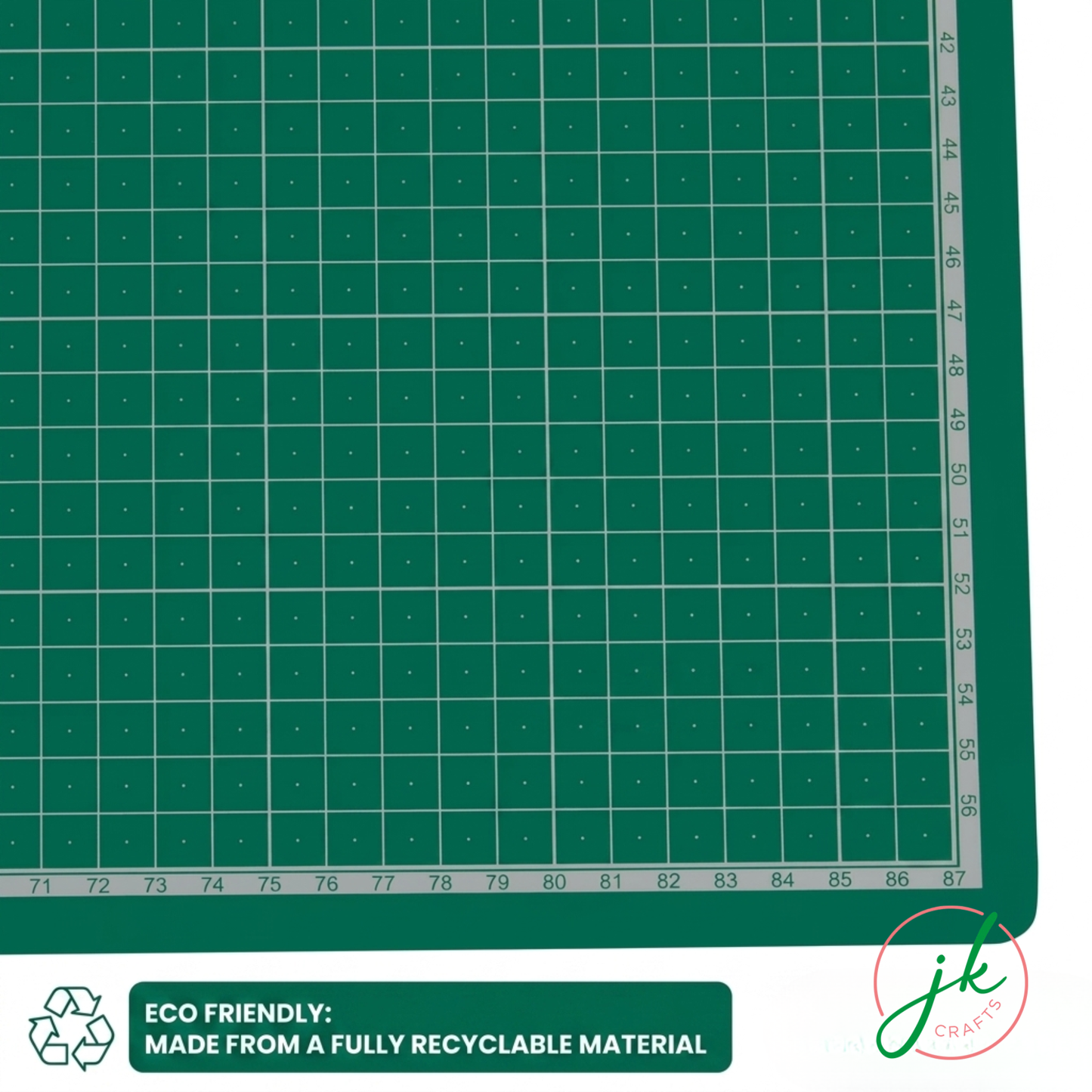 Green cutting mat with grid pattern and recycling logo, featuring the brand 'JKCrafts'.