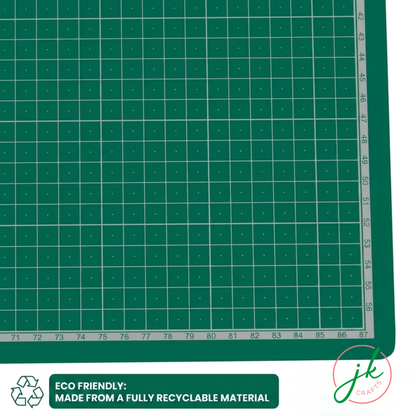 Green cutting mat with grid pattern and recycling logo, featuring the brand 'JKCrafts'.