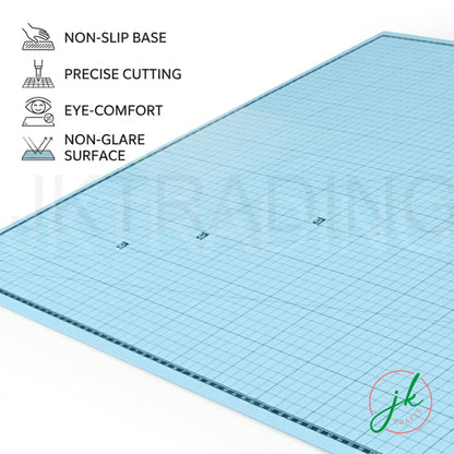 Wide-angle view of the pastel blue A1 workbench protector showing cross-diagonal bias lines and angle markings.