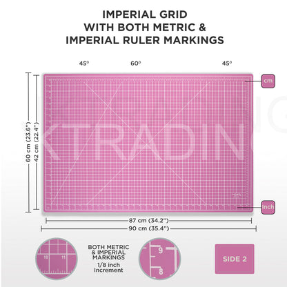 Pink A1 craft cutting mat featuring an imperial grid with both metric and imperial ruler markings for versatile workshop measuring.