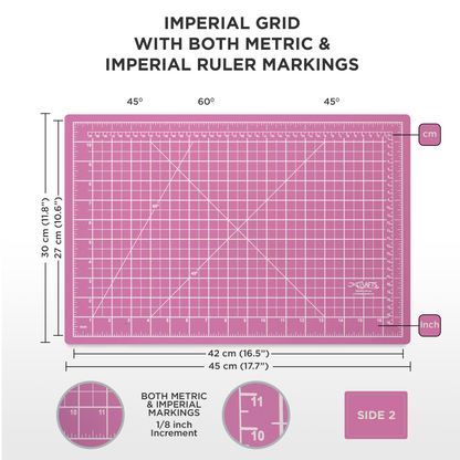 Pink cutting mat with grid and ruler markings for imperial and metric measurements