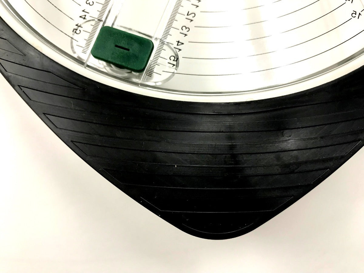 Close-up of a tire with tread pattern and rim detail on a white background