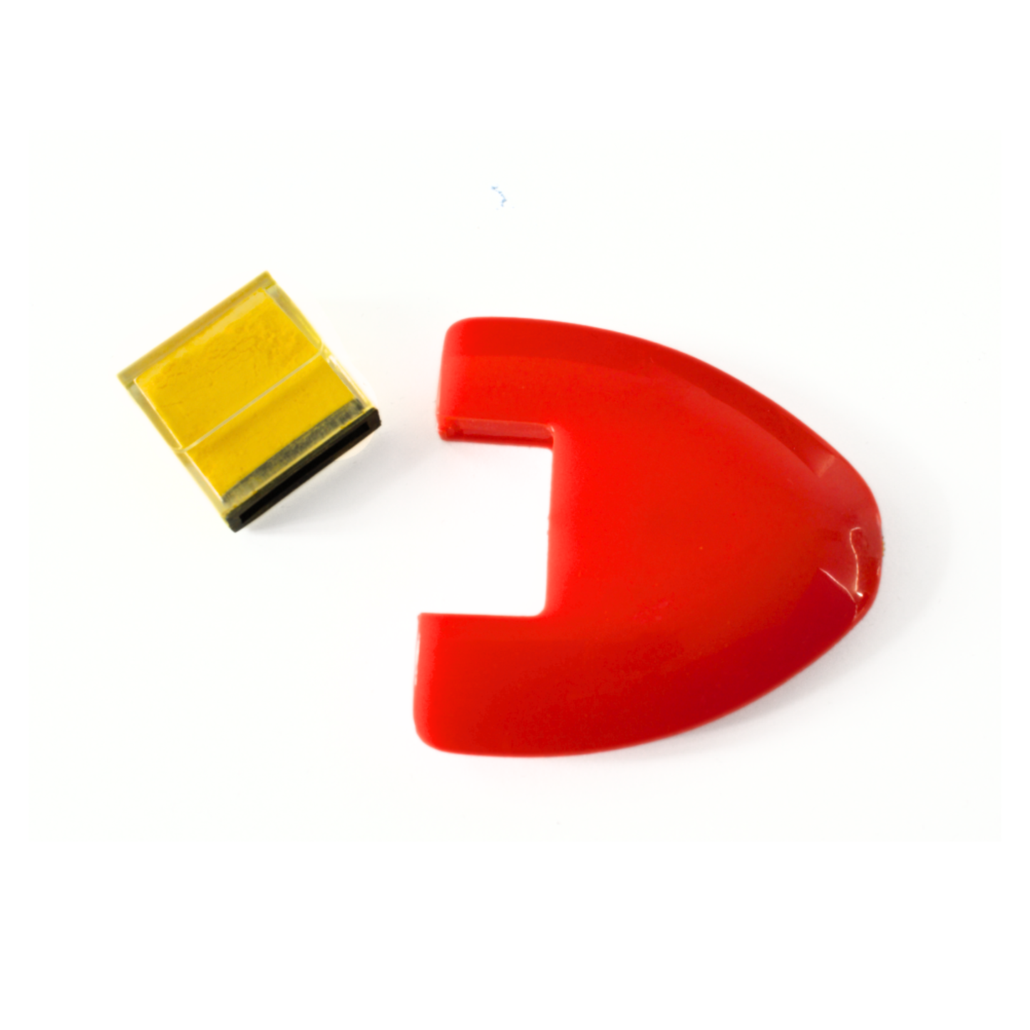 Red ergonomic tailors chalk wheel mouse casing shown next to a removable yellow powder refill cartridge.