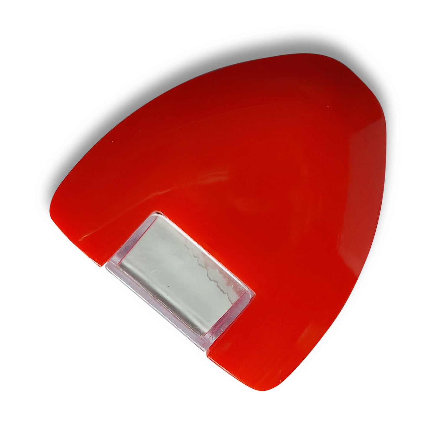 Top-down view of the red mouse-style fabric marker tool loaded with a white chalk powder cartridge.