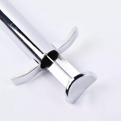 Close-up profile of the durable T-bar handle and plunger on a high-grade stainless steel sculpting gun.