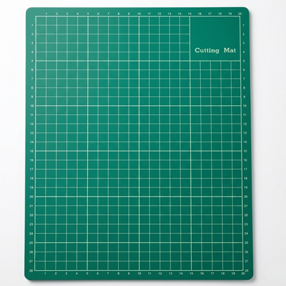 Front grid profile of a classic green 3-ply A4 self-healing cutting mat with yellwo metric grid lines on a white backdrop.