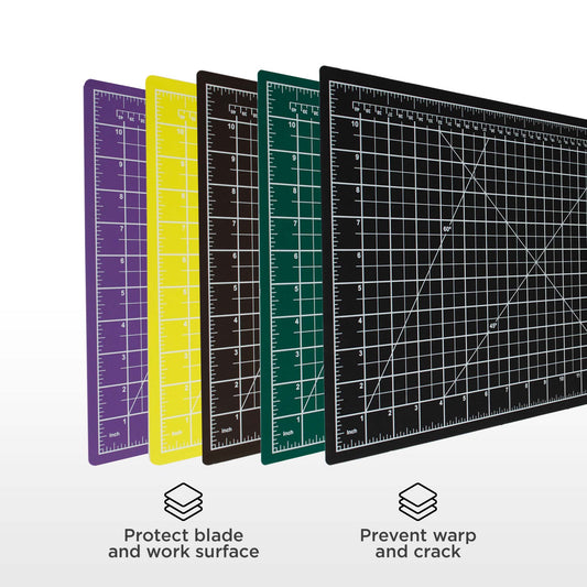 Set of four cutting mats in different colors with measurement grids on a white background.
