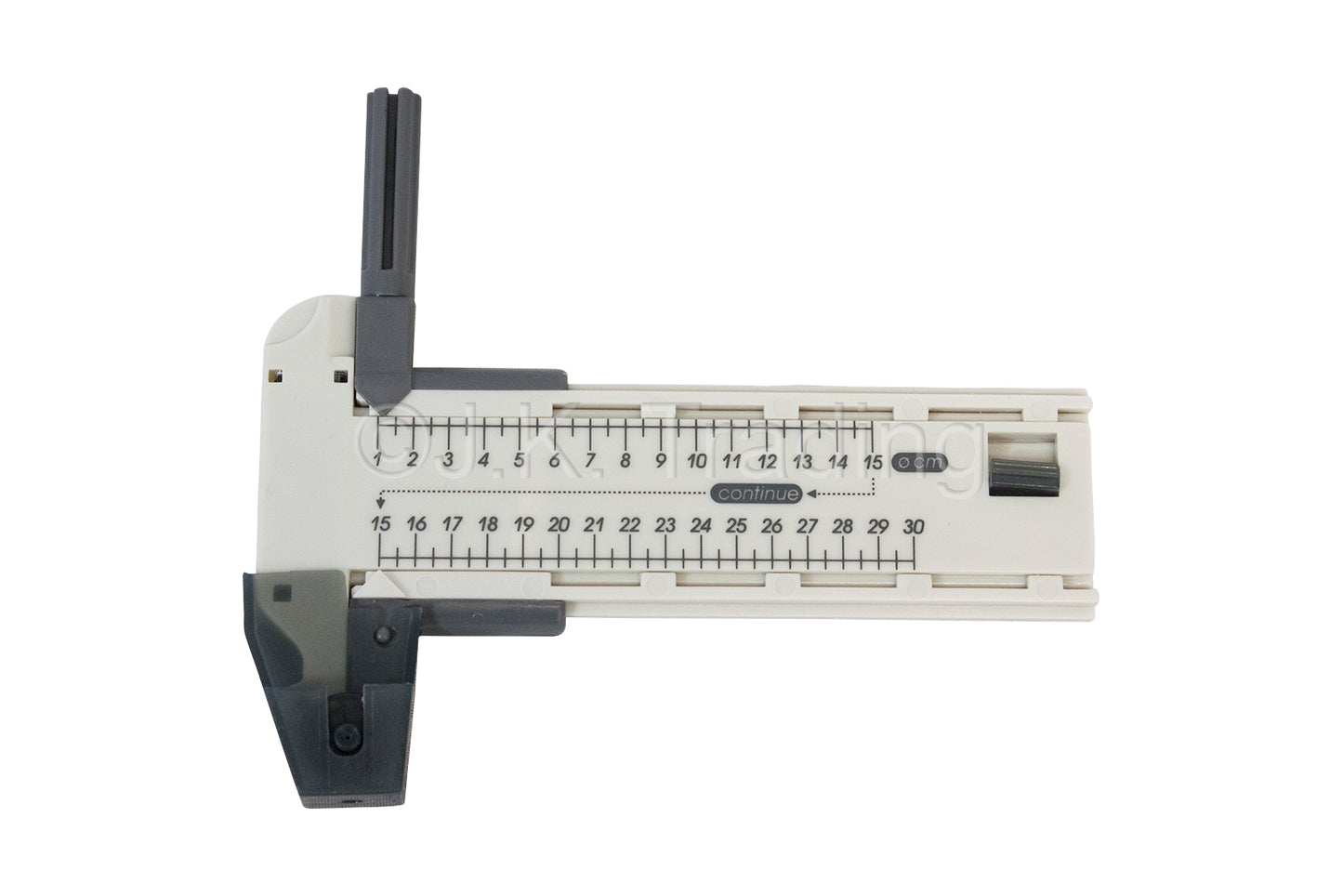 T-shaped edge-guided rotary paper slicer tool mechanism shown on a clear plastic measuring guide track.