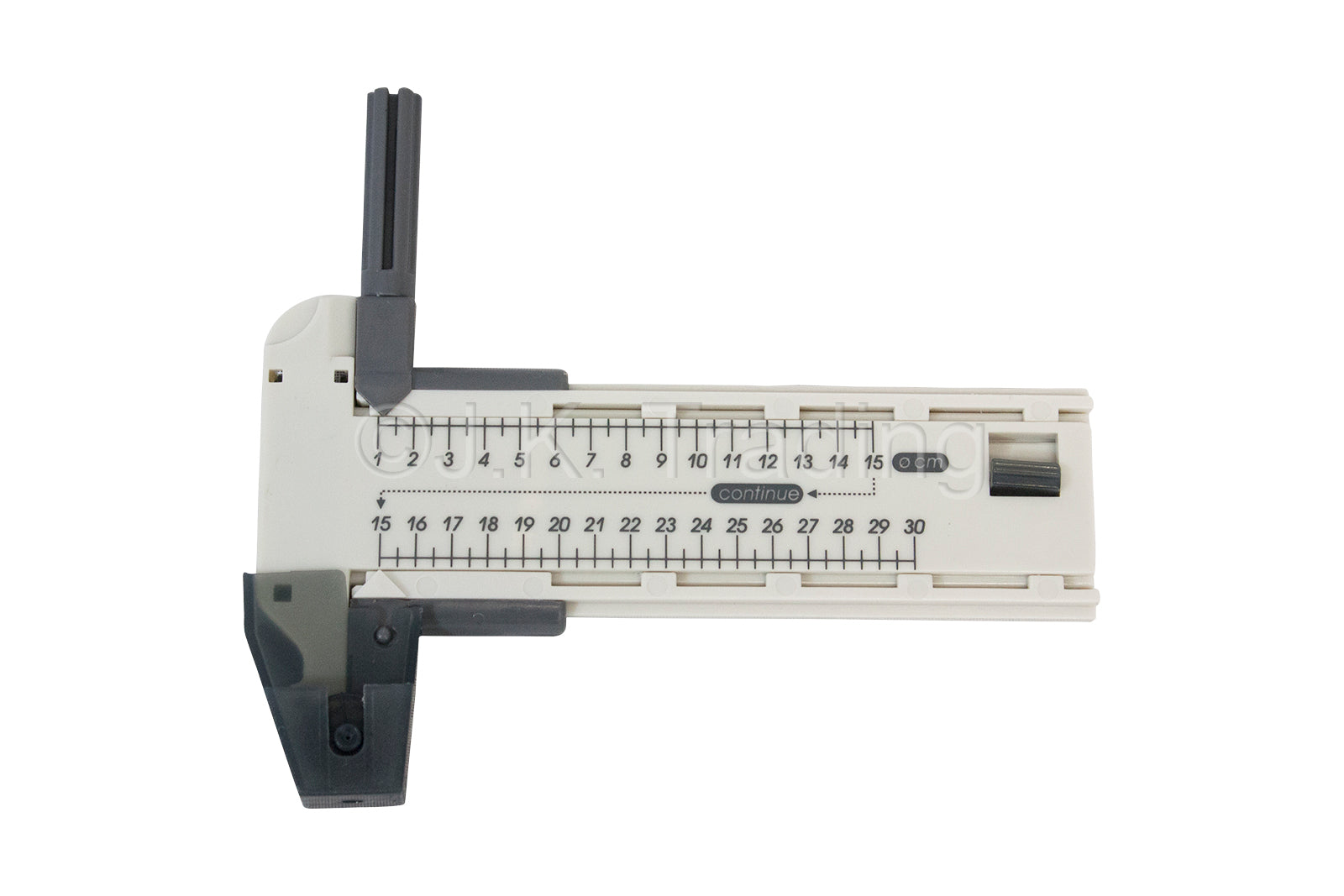 T-shaped edge-guided rotary paper slicer tool mechanism shown on a clear plastic measuring guide track.