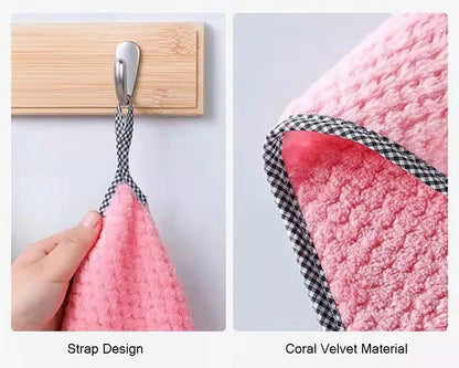Pink towel with strap design and coral velvet material on a white background