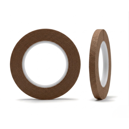 Two rolls of brown tape on a white background