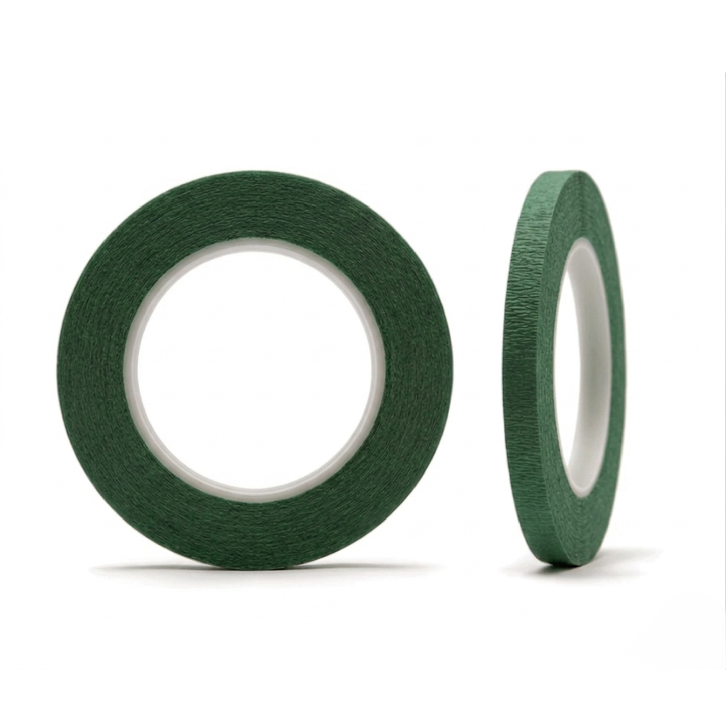 Two rolls of green tape on a white background