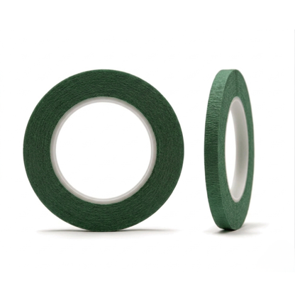 Two rolls of green tape on a white background