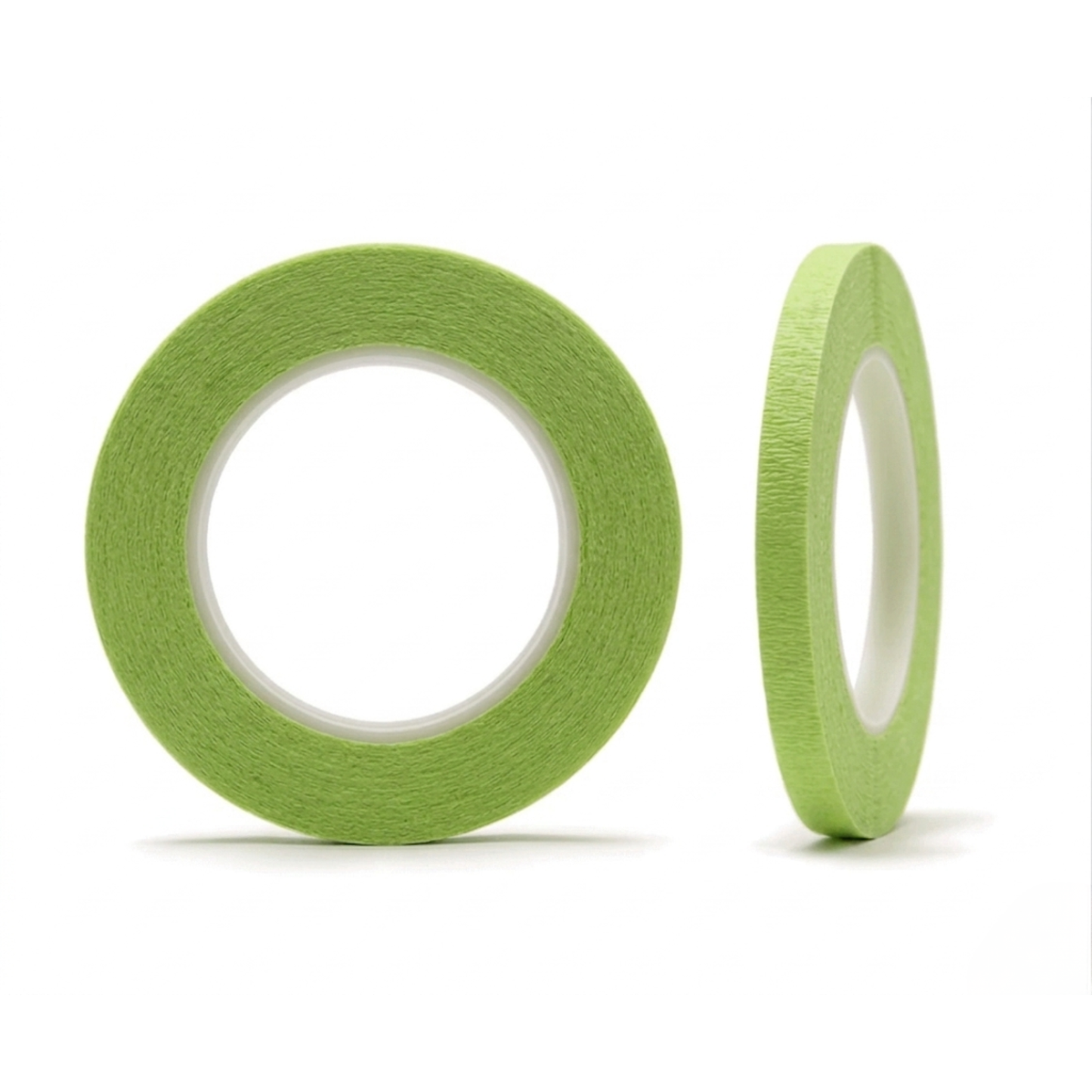 Two rolls of green tape on a white background