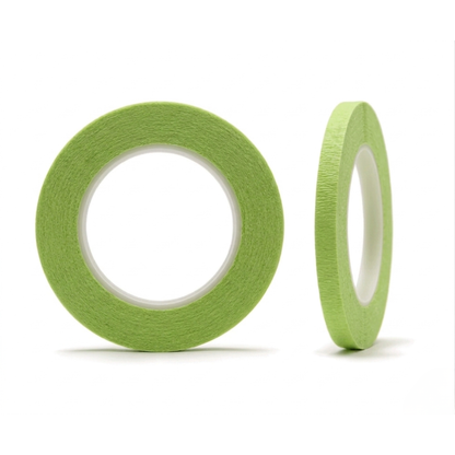 Two rolls of green tape on a white background