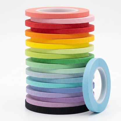Stack of colorful draping tape rolls on a white background