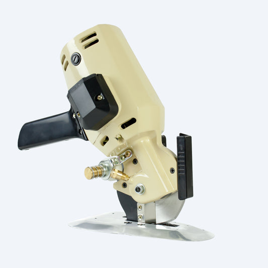 Heavy-duty cream-colored industrial electric fabric cutter with an octagonal blade isolated on a white background.