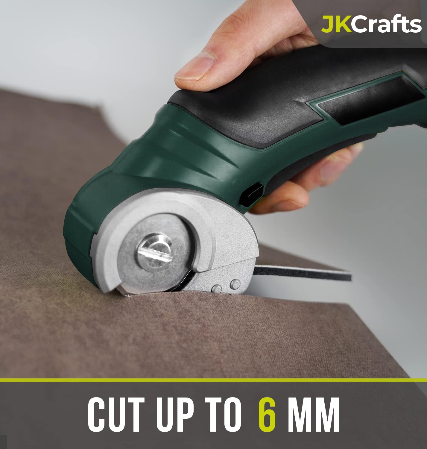Handheld mini electric fabric cutter cleanly slicing through thick brown felt material up to 6mm deep.
