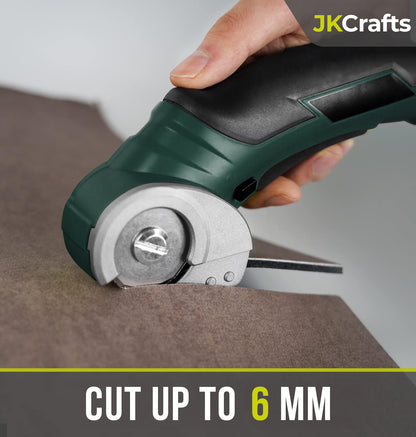 Handheld mini electric fabric cutter cleanly slicing through thick brown felt material up to 6mm deep.