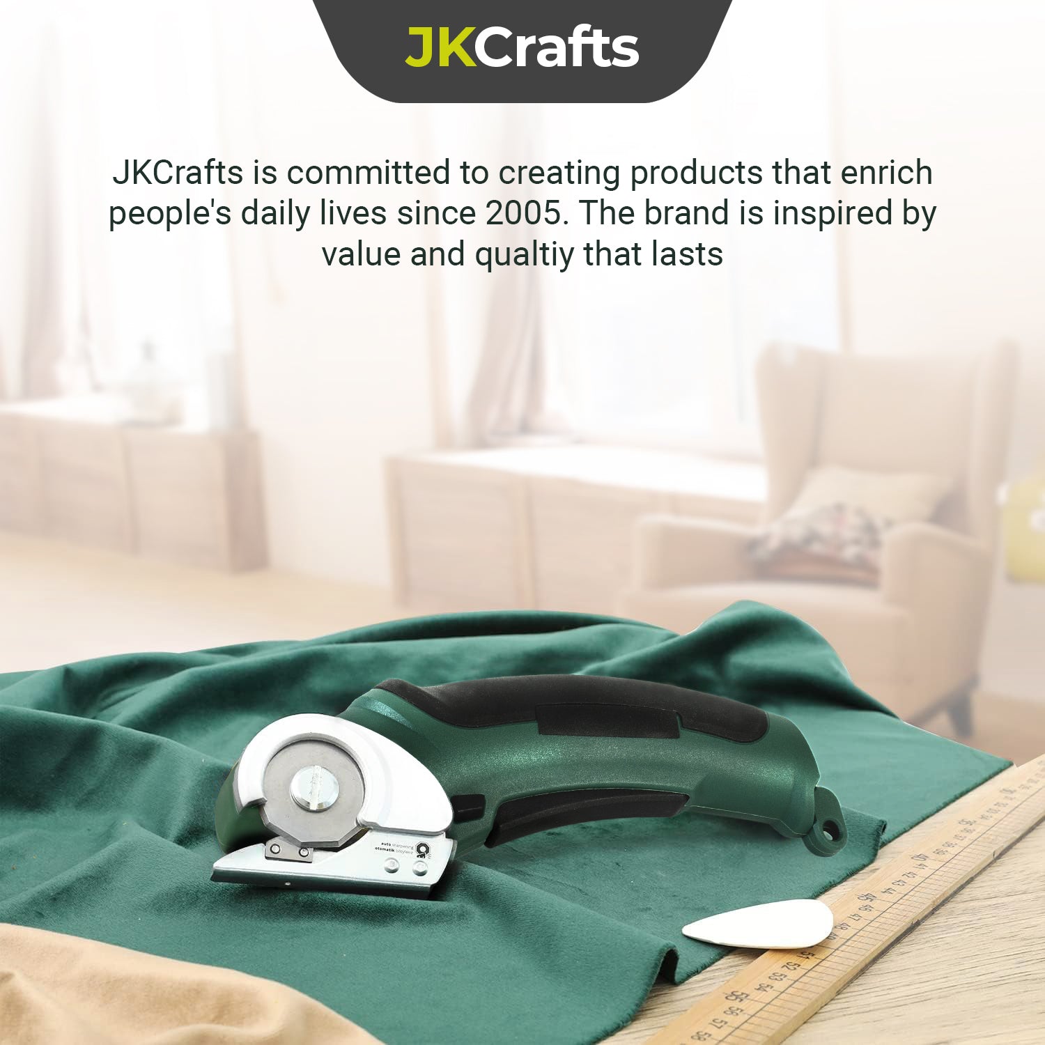 Brand lifestyle graphic showcasing the green electric craft scissors resting on smooth folded silk fabric.