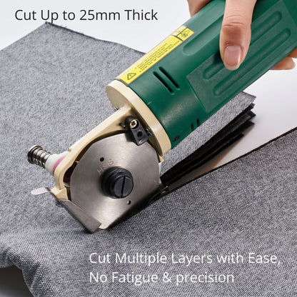 Hand operating the industrial cloth cutter to slice smoothly through a thick stack of grey fabric sheets up to 25mm deep.
