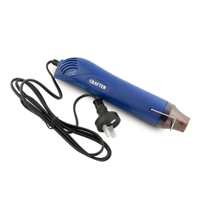 Blue hot glue gun with black cord on a white background