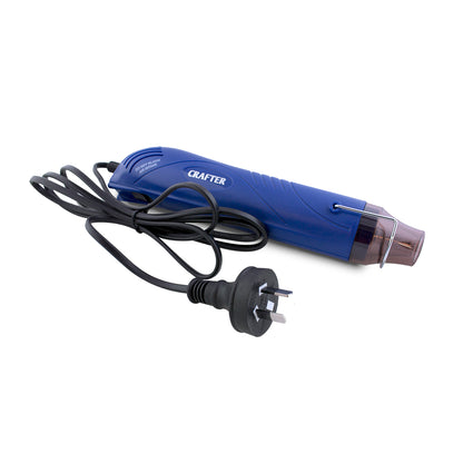 Blue hot air gun with cord and plug on a white background