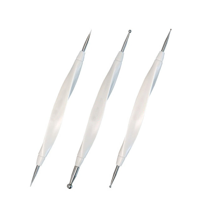 Three white double-sided scoring stylus pens for paper crafting angled on a white backdrop.