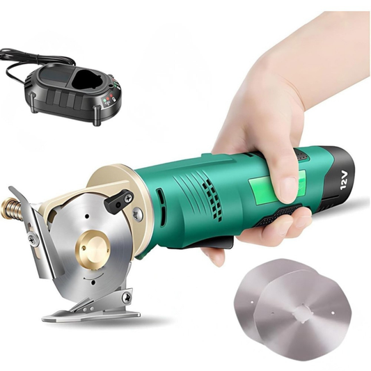 Hand holding a green electric rotary fabric cutter machine paired with a charging dock and replacement blade.