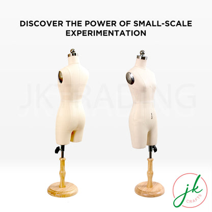 Two mannequins on stands with text 'Discover the power of small-scale experimentation' and a logo in the corner.
