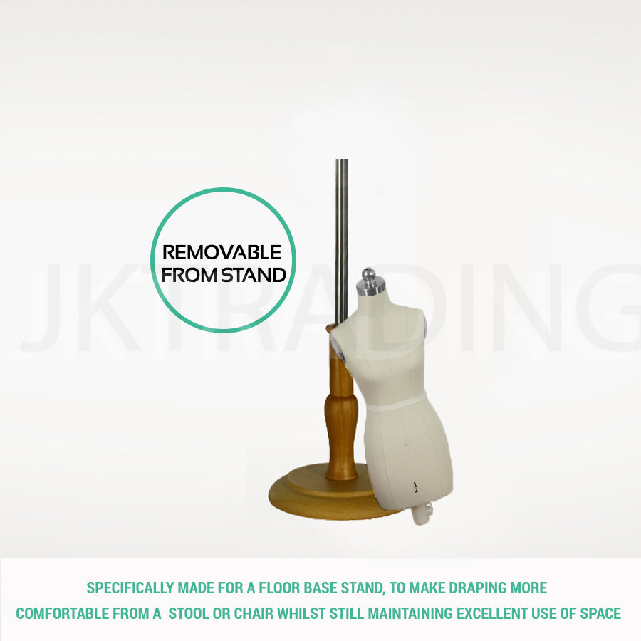 Mannequin torso on a wooden stand with text indicating it can be removed from the stand.