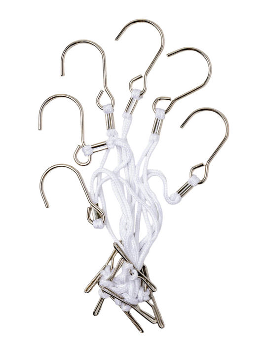 Cluster of professional metal t-bar hanging pattern hooks with white nylon cords for studio organization.