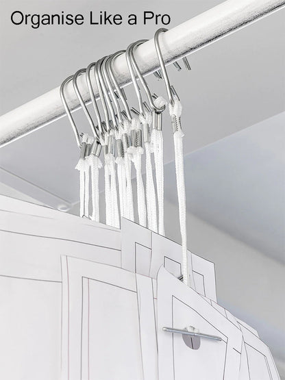 Multiple master paper patterns neatly organized on a rolling apparel rail using white nylon pattern hooks.