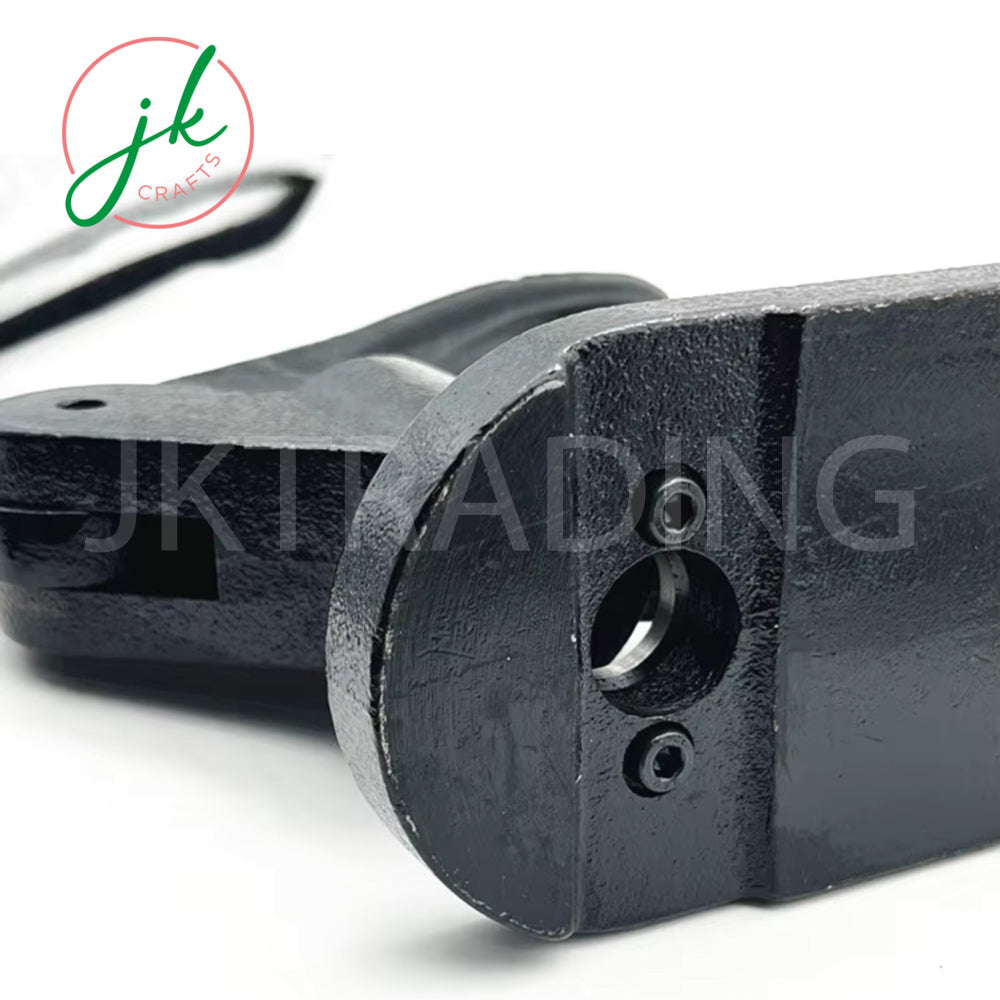 Close-up of a metal component with 'JK Trading' branding on a white background