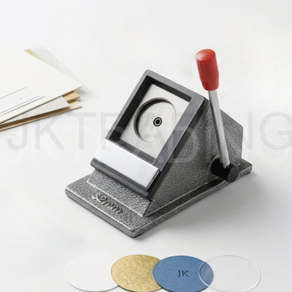 Circular paper cutter with a red handle on a white background