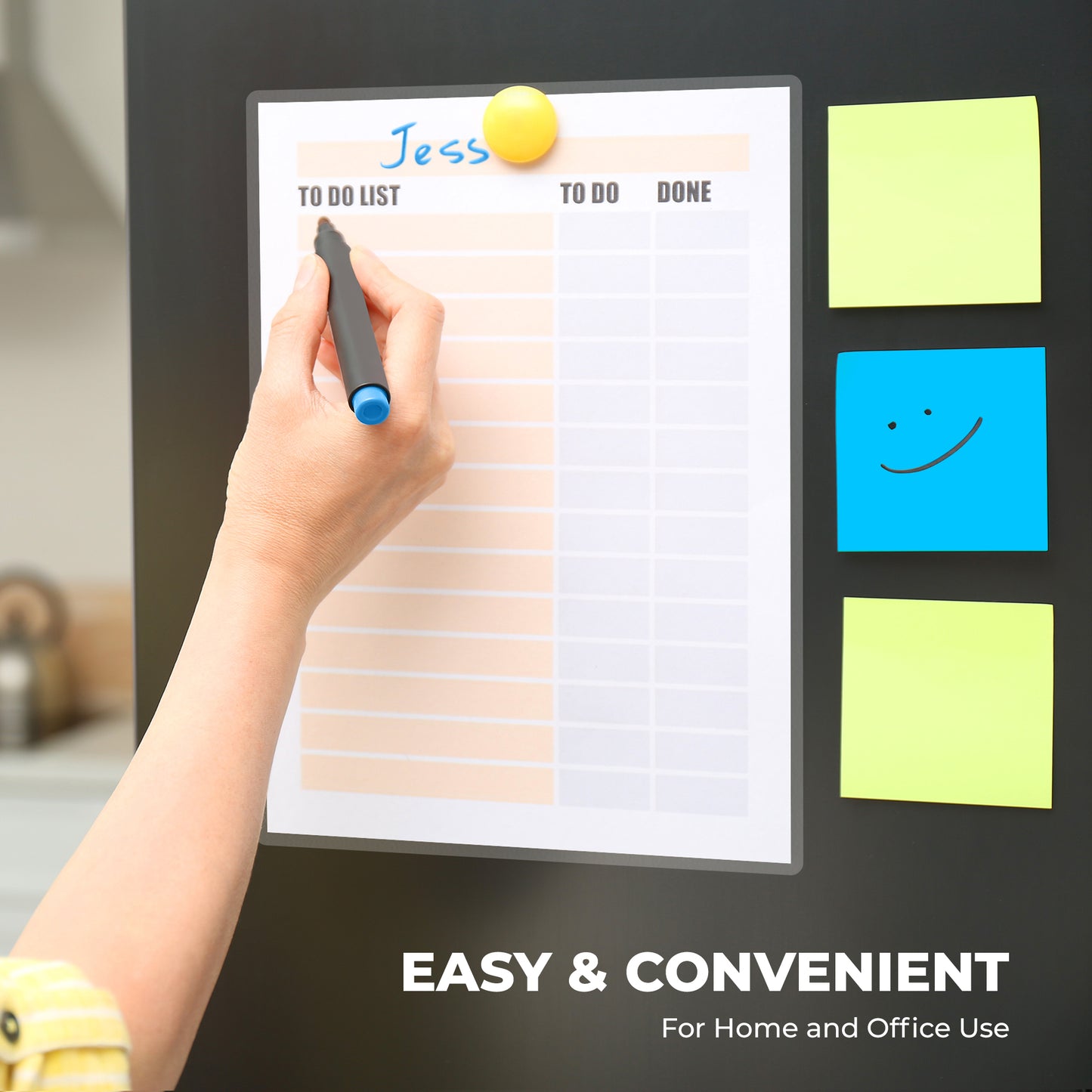 Teacher checking off items on an easy-to-use reusable dry erase wall calendar planner sealed with lamination sheets.