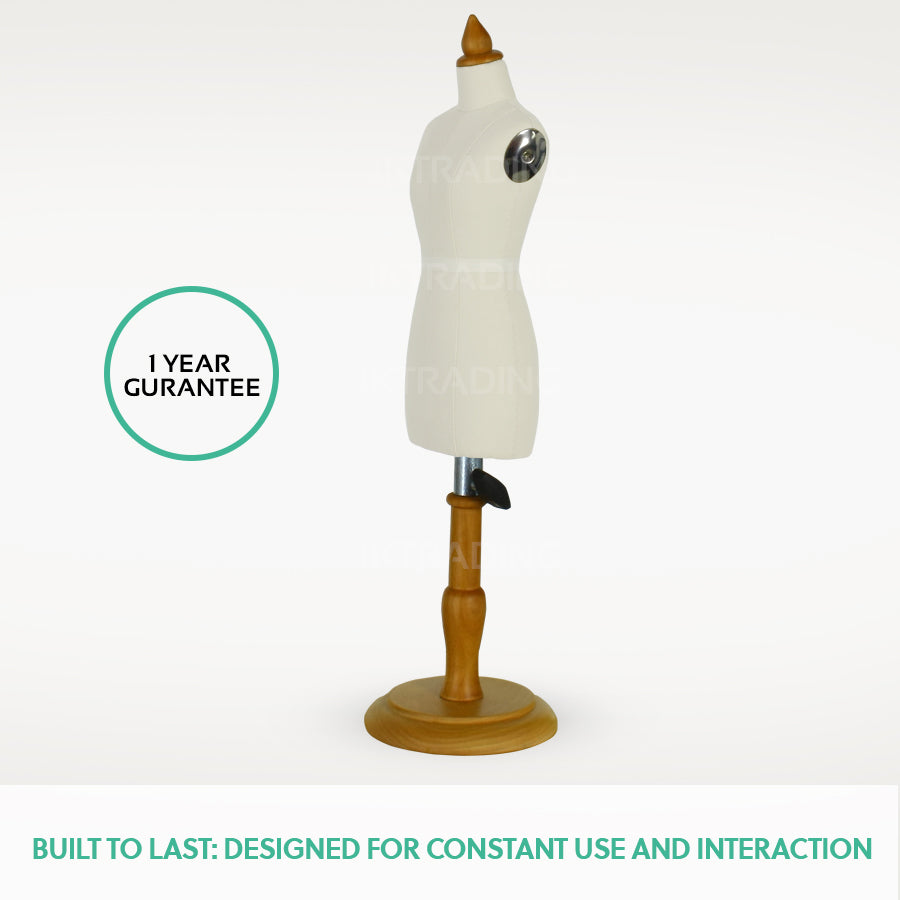 Mannequin torso on a wooden stand with a '1 Year Guarantee' label on a white background.