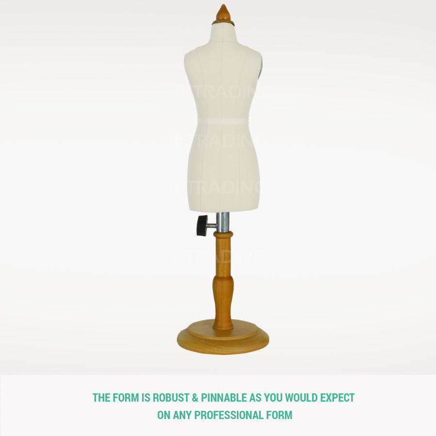 Three-quarter back profile view of the pinnable mini female draping form with a natural wood table base.