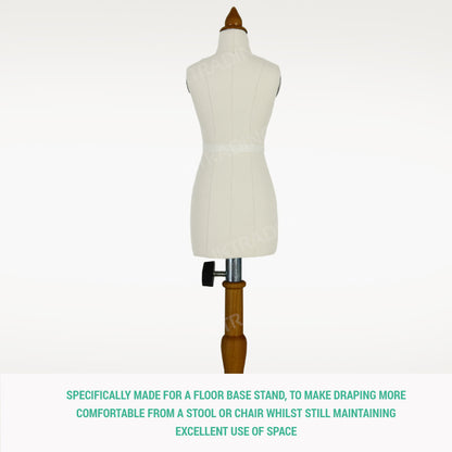 Mannequin torso on a wooden base with text on a white background