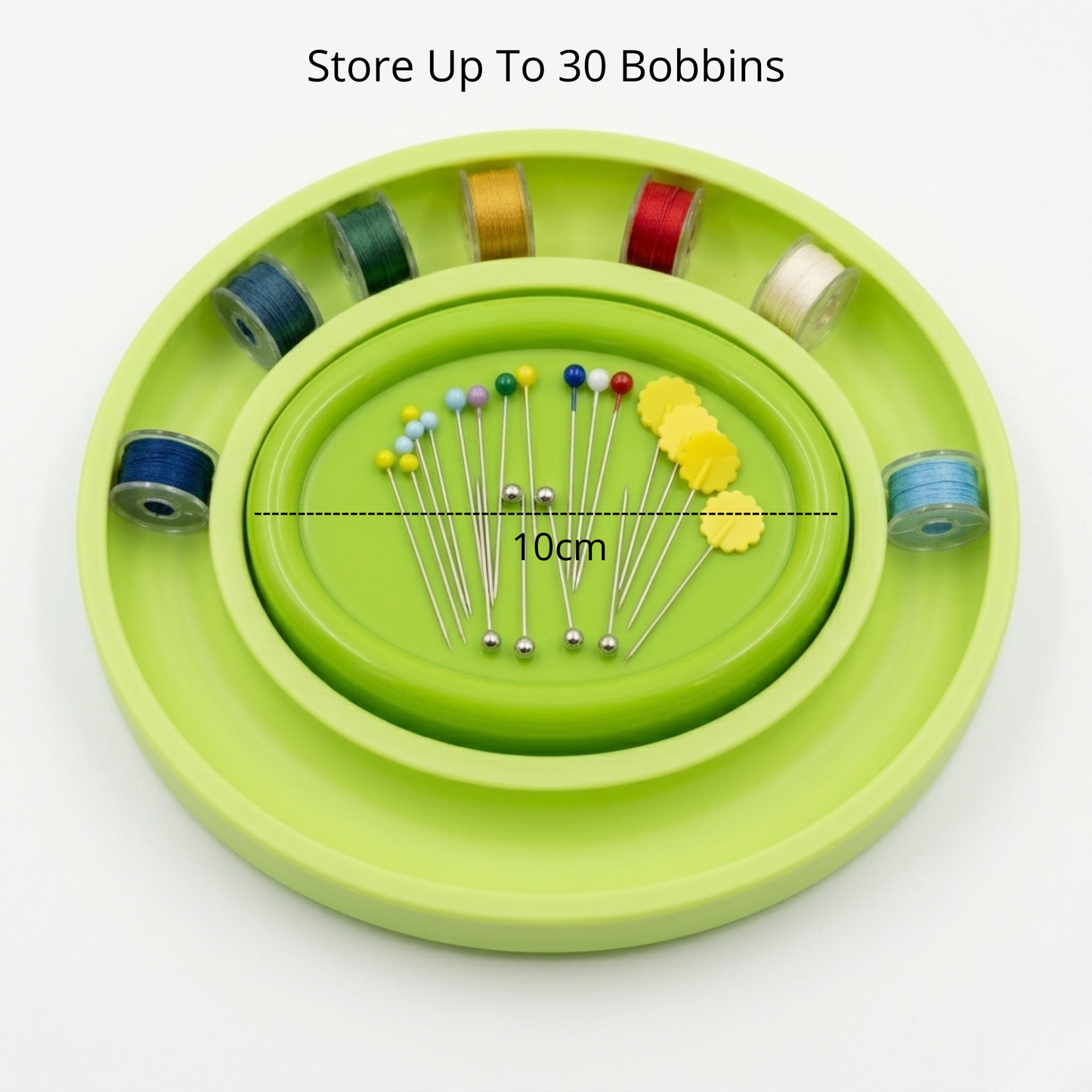 green oval bobbin ring holder with a magnetic pin holder on a white background