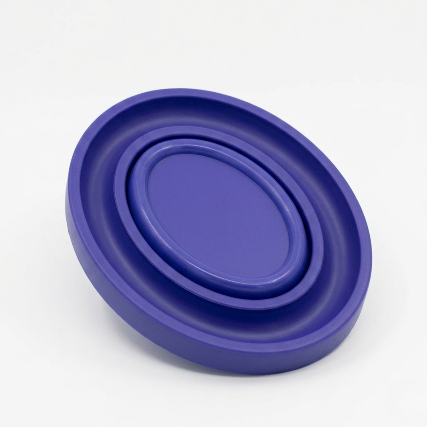 blue oval bobbin ring holder with a magnetic pin holder on a white background
