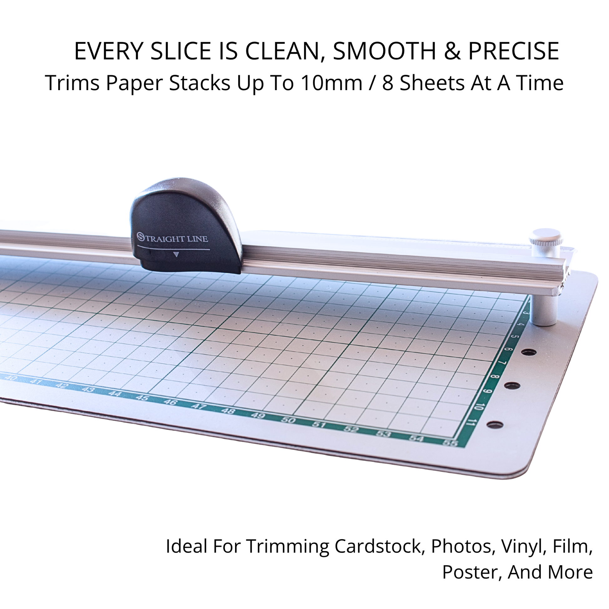 Precision sliding blade assembly moving smoothly across a gridded crafting alignment mat board.