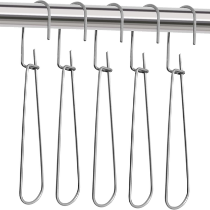 Five heavy-duty all-metal pattern hooks neatly lined up hanging on a studio garment rail rod.
