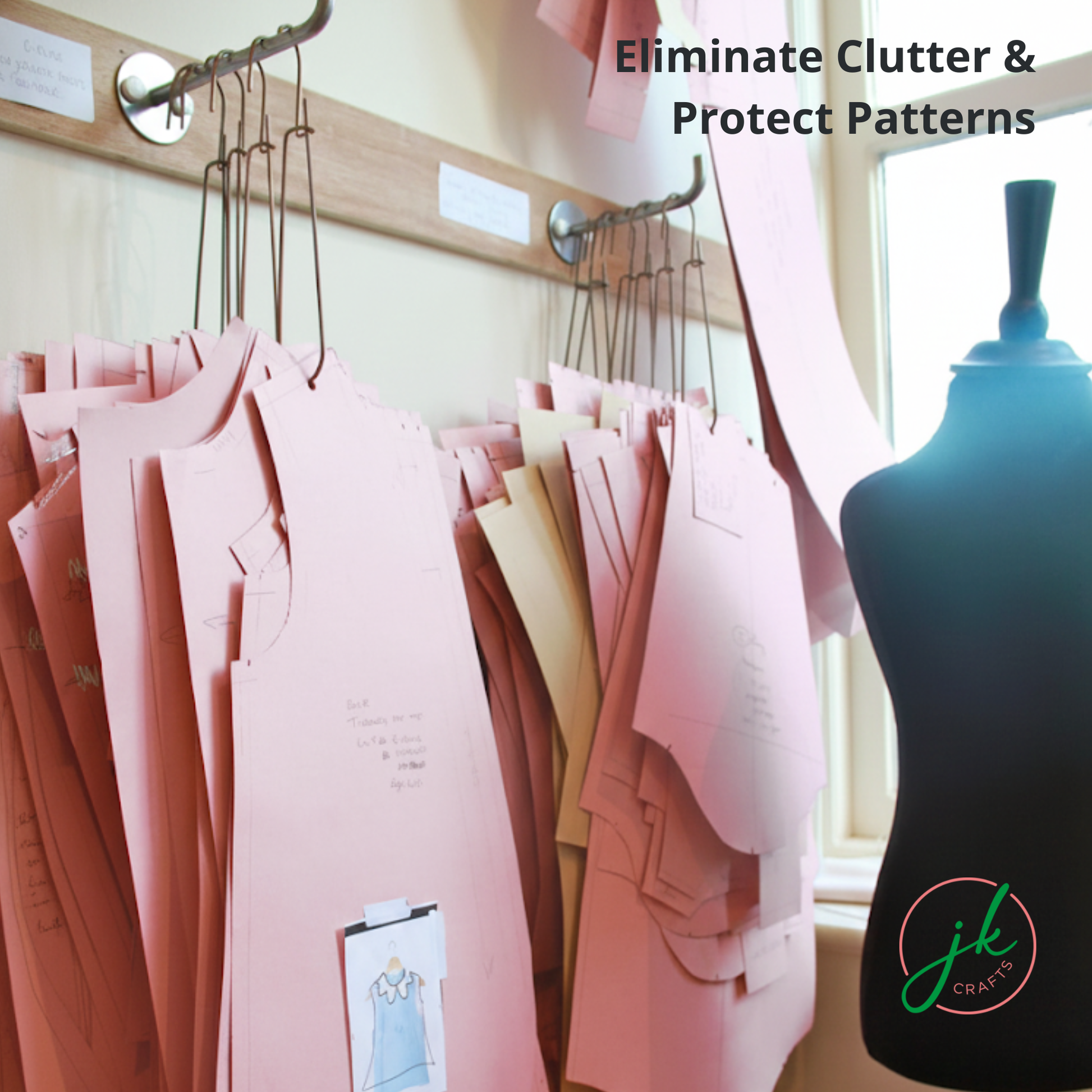 Pink paper apparel slopers organized efficiently on wall racks next to a dress form mannequin using Pattern Hooks.
