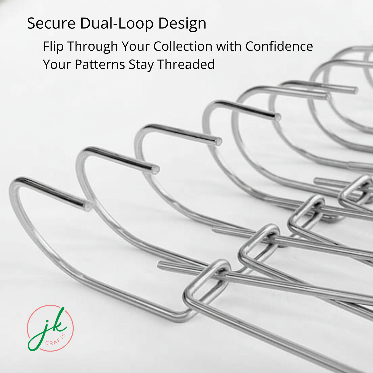 Close-up of the secure dual-loop design on a row of steel pattern hangers allowing smooth flip-through access.