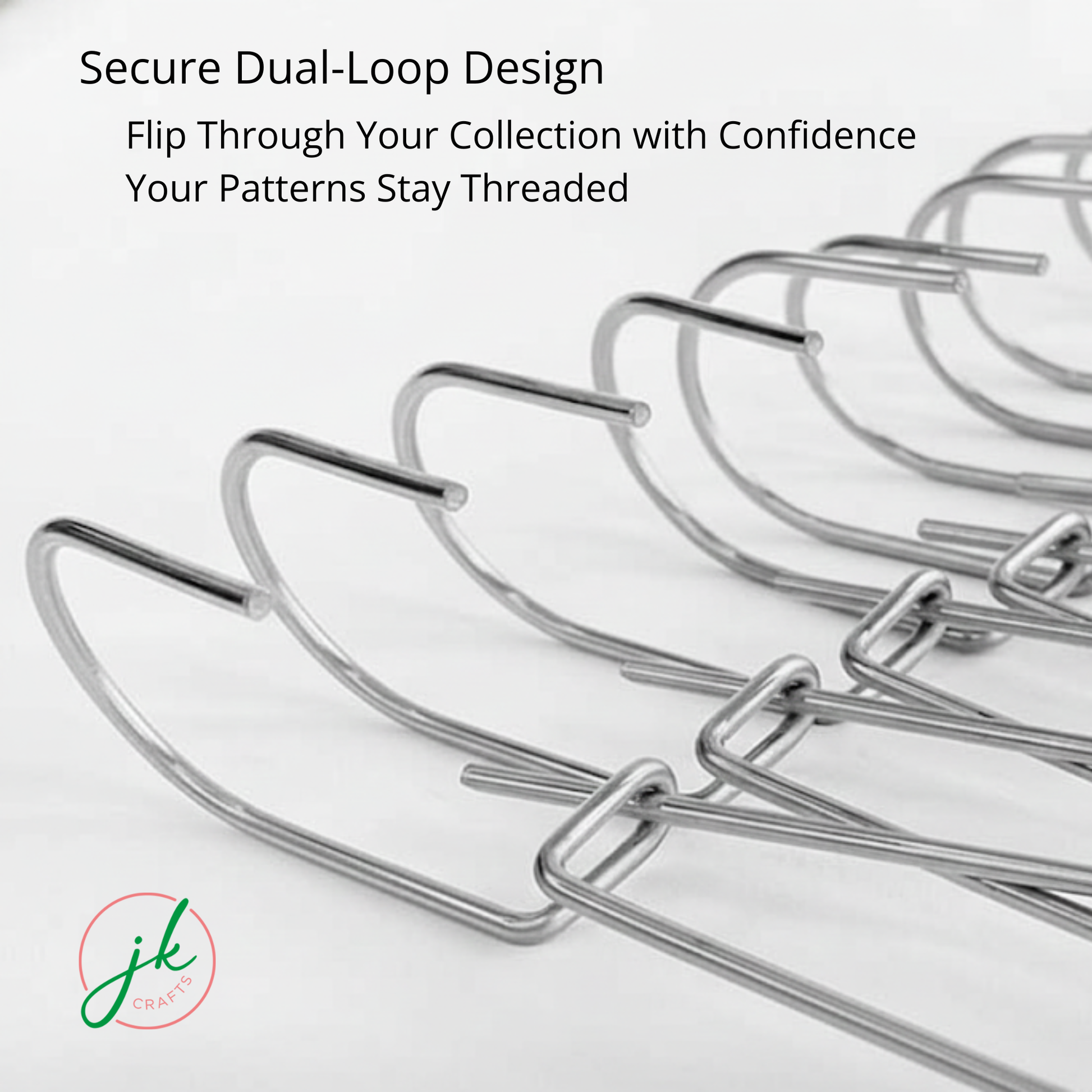 Close-up of the secure dual-loop design on a row of steel pattern hangers allowing smooth flip-through access.