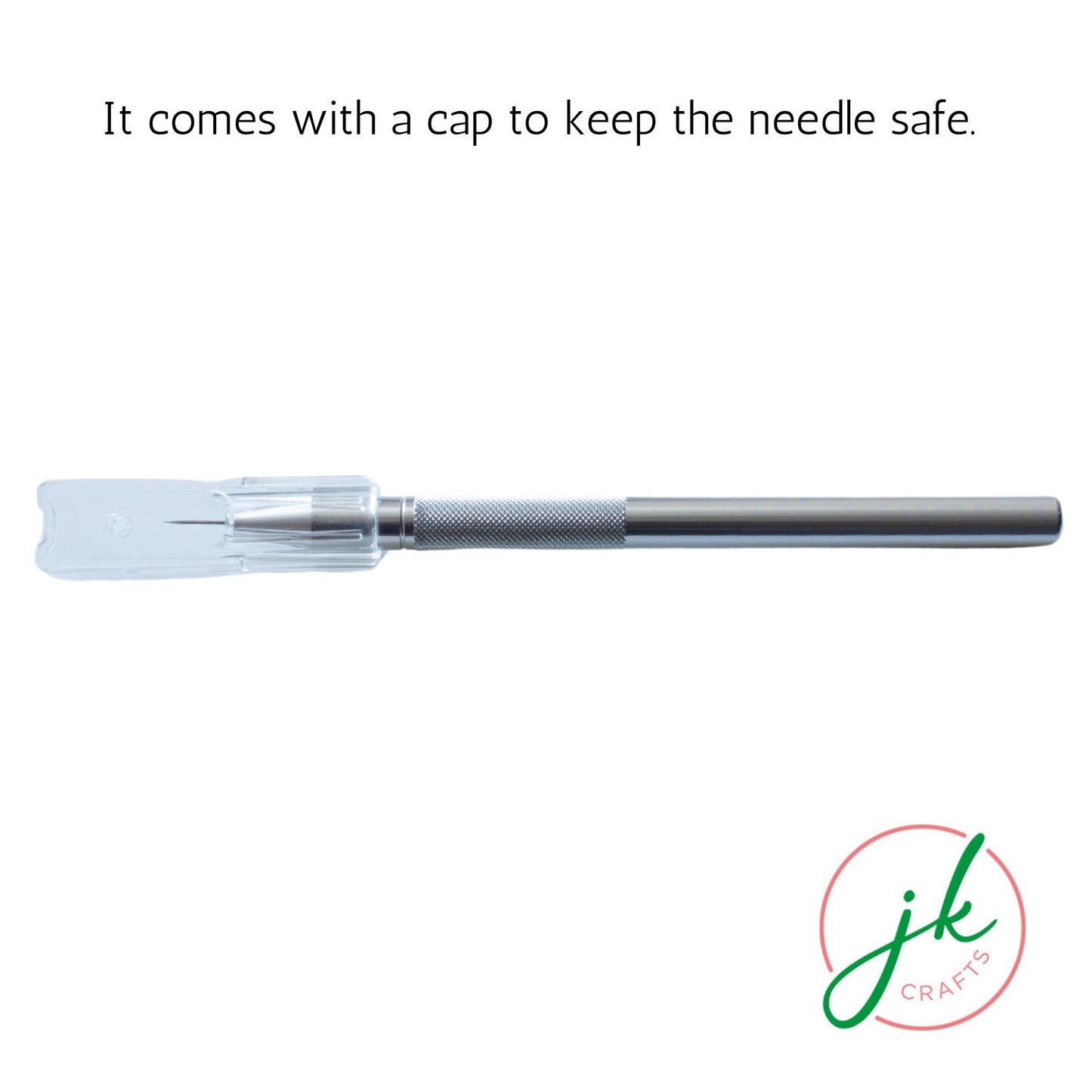 Horizontal view of the sleek metal pricking pen resting inside its transparent protective safety sleeve.